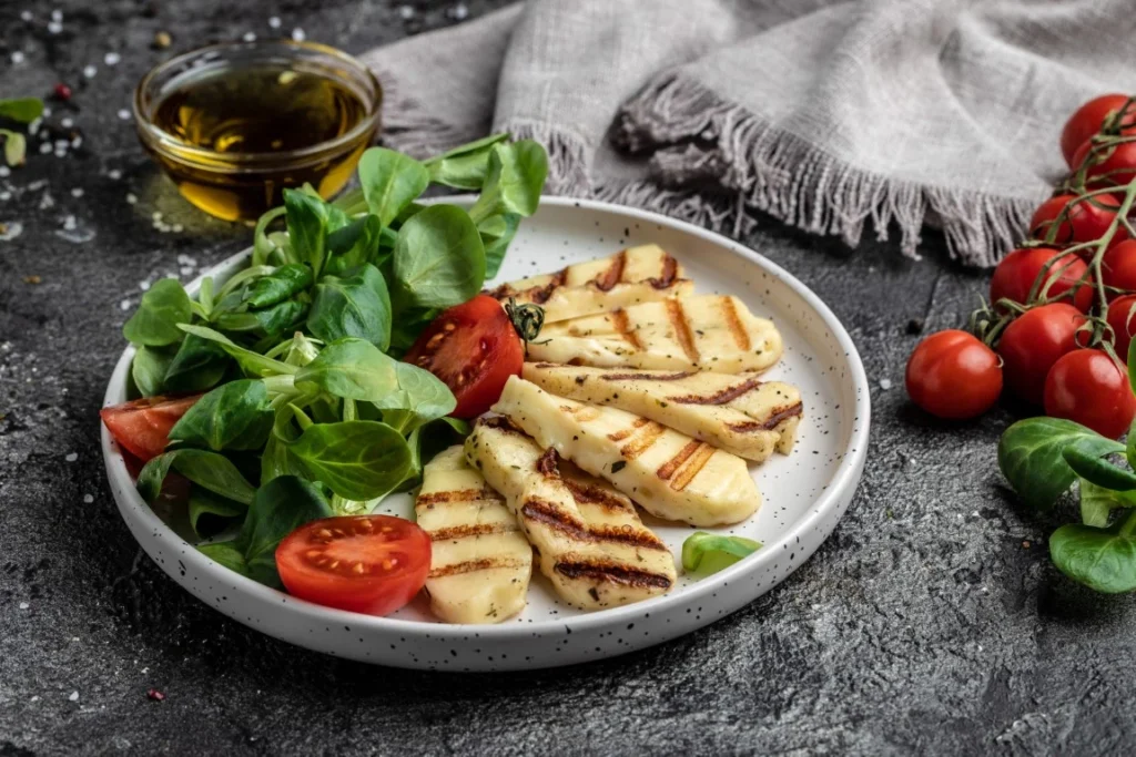 Ladokola in old port skiathos with grilled halloumi cheese tomatoes capers lettuce arugula cyprus squeaky cheese top view (Medium) (1)